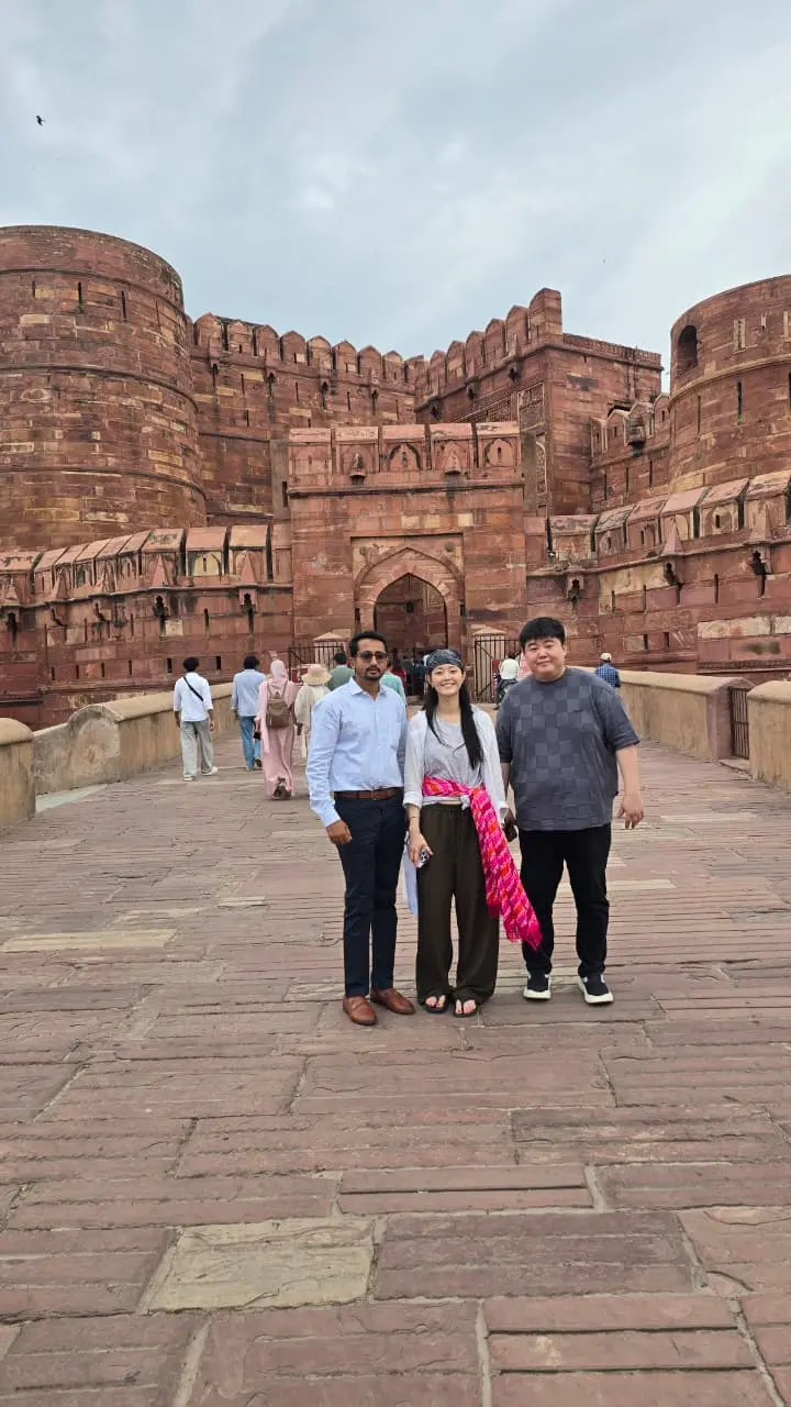 Agra Fort's red sandstone ramparts at golden hour