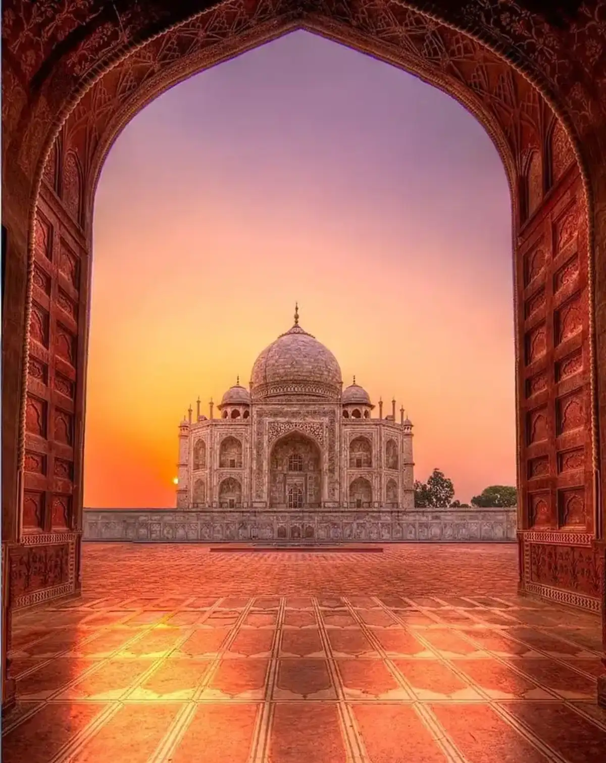 The Taj Mahal's marble mausoleum framed by the charbagh gardens